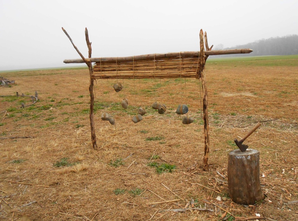 A primitive loom is set-up for the making of woven mats to be used in the interior bedding of longhouse.